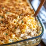 Million Dollar Chicken Noodle Casserole Recipe – The Best Ever 5 Spoonful of creamy chicken noodle casserole with golden onion topping in glass dish
